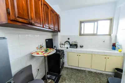 a kitchen with a counter and a sink in it at Dar Lamine Duplex in Rabat