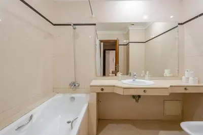 a bathroom with a bath tub and a sink at TT Holidays 3BR Racine Casablanca in Casablanca