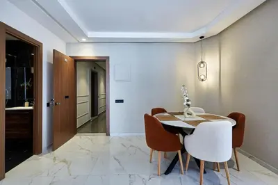 a dining room with a table and chairs at Your Home Away from Home 2 Bed Flat With Parking in Casablanca