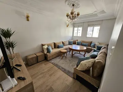 a living room with a couch and a table at Cosy and Complete Casa appartment in Casablanca