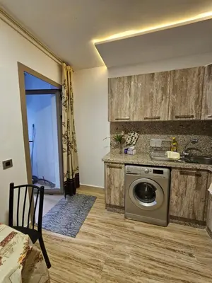 a kitchen with a sink and a washing machine at MIA Appartement N1 - Élégance, Confort et Sérénité in Casablanca