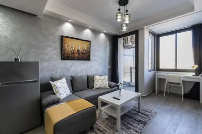 a living room with a couch and a table at Stylish Studio à Ain Sebaa in Casablanca