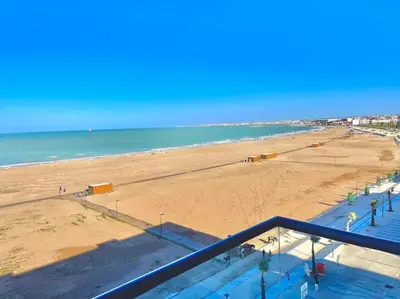 a view of the beach from a balcony at Miramar Luxury apartment Front Beach View in Mohammedia
