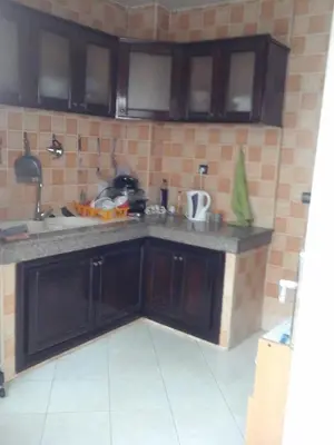 a kitchen with a sink and a counter top at Appartement Bourgogne casa Anfa in Casablanca