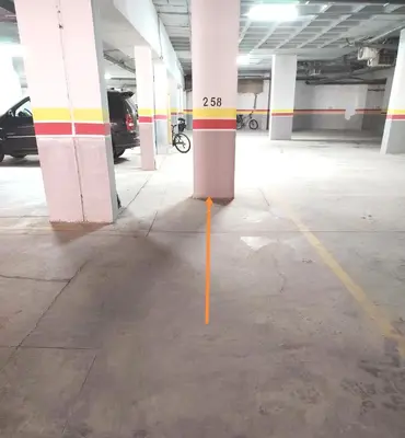 a yellow pole in the middle of a parking garage at Glorious NOUACEUR in Nouaceur