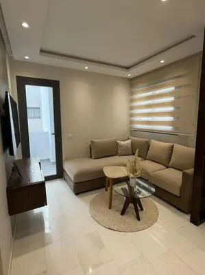 a living room with a couch and a table at Casa Bay in Casablanca