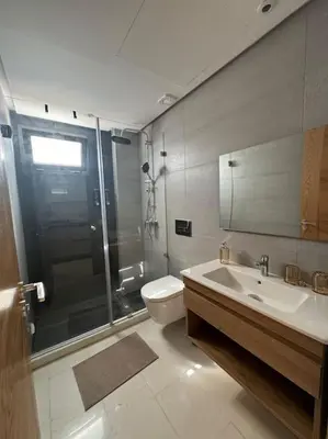 a bathroom with a shower and a toilet and a sink at Casa Bay in Casablanca