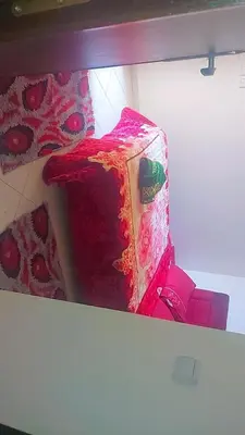 a red cake sitting on top of a shelf at Bouznika in Bouznika