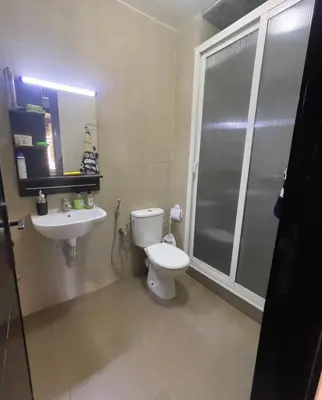 a bathroom with a toilet and a sink at Cozy Apartment Dar Bouazza in Casablanca
