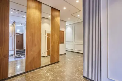 a large room with wooden walls and a large mirror at Luxurious apartment in the heart of Maarif Casa in Casablanca