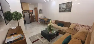 a living room with a couch and a table at Aerostay Jamal in Dah Hammou Ben Cheïkh