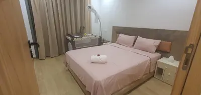 a bedroom with a bed with a box on it at Aerostay Jamal in Dah Hammou Ben Cheïkh