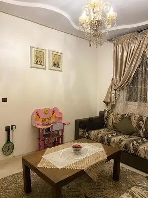 a living room with a couch and a table at Luxurious Holiday Home 2 in Temara