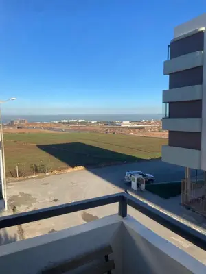 a view of the ocean from the balcony of a building at Charmant appartement 2 chambres à Casablanca, à 10 min de la plage in Casablanca