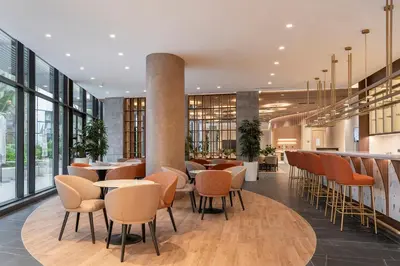 a restaurant with tables and chairs and windows at Eurostars Casa Anfa in Casablanca