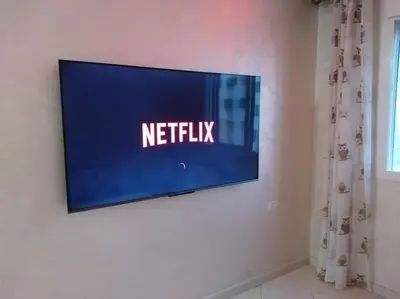 a flat screen tv hanging on a wall at Omarex in Casablanca