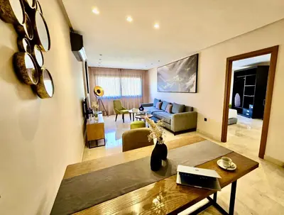 a living room with a couch and a table at AS Premium By Soho Hotels Maarif in Casablanca