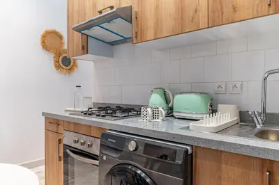 a kitchen with a stove and a sink at AeroStudio in Nouaceur