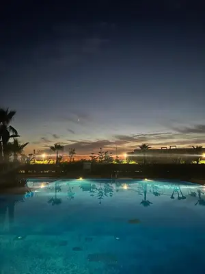 a large swimming pool at night with the sky at Bleu Beach Résidence, Sidi Rahal in Sidi Rahal