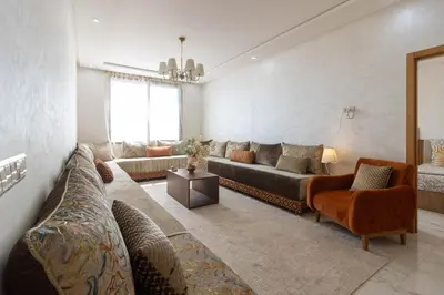 a large living room with a couch and chairs at Fun and Sun - Appartement de luxe - Dahomey Beach - Bouznika in Bouznika