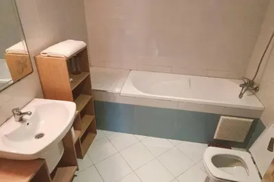 a bathroom with a sink and a tub and a toilet at Sun Palace Palage des Sablettes D5 in Mohammedia