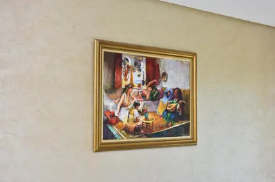 a painting on a wall of a painting on a wall at Bens White House in AÃ¯n el Ksob