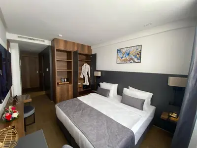 a bedroom with a large bed in a room at Executive Boutique Hotel Rabat in Rabat