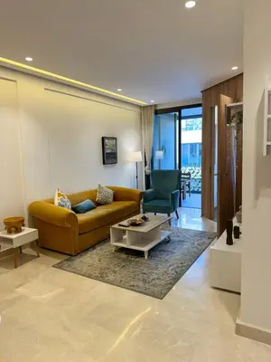 a living room with a couch and a table at Presidential living princess in Casablanca