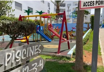 a playground at a resort with a slide at La siesta beach resort two bedroom appartement in Mohammedia
