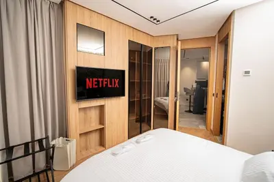a bedroom with a netflix sign on a wall at Le studio in Casablanca