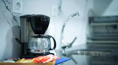 a blender sitting on a counter next to a sink at Bleu Studio in Rabat