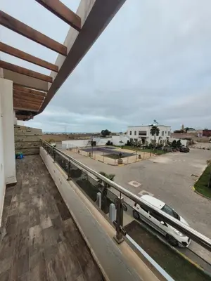 a car parked on a balcony of a building at Charmante villa vue sur la mer in Tamaris