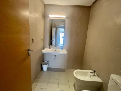 a bathroom with a toilet and a sink at Zen & Welcoming CFC - Garage & Tramway in Casablanca