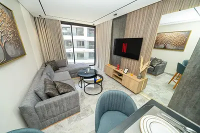 a living room with a couch and a tv at Twenty Four Inn 306 in Casablanca