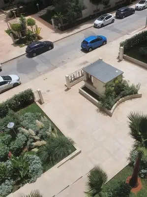 an aerial view of a building with cars parked on a street at Superhote in Nouaceur