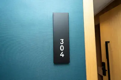 a elevator door with the number thirty four on it at Twenty Four Inn 304 in Casablanca
