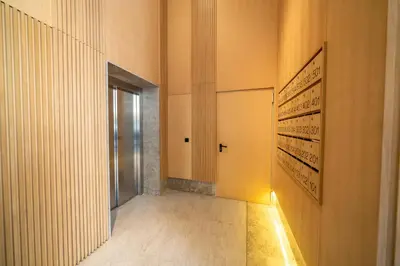 a hallway with a door and a wall with paintings at Twenty Four Inn 304 in Casablanca