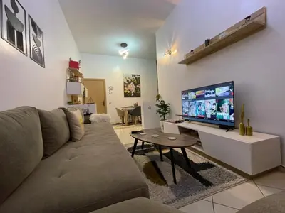 a living room with a couch and a flat screen tv at Chez vous à Skhirate in Skhirat