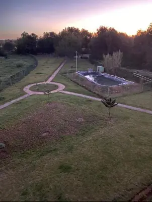 an aerial view of a yard with a swimming pool at Appartement de Luxe à Bahia Golf Beach Spacieux de 126 m in Bouznika