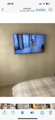 a picture of a person standing in front of a mirror at Charmant appartement in Casablanca