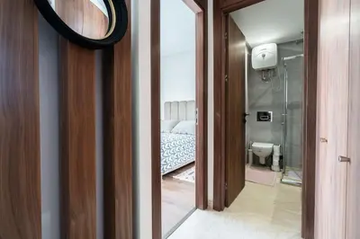 a mirror in a room with a bed and a bathroom at Superbe appartement à Casablanca in Casablanca