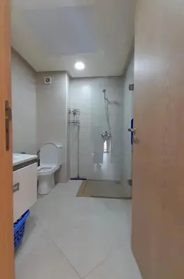 a bathroom with a shower and a toilet at Rayyan Appartement in Bouznika