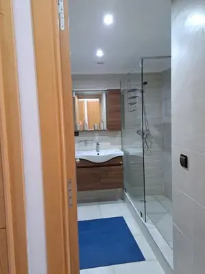 a bathroom with a shower and a sink at Villa avec piscine, Hacienda Beach Sidi Rahal in Sidi Rahal