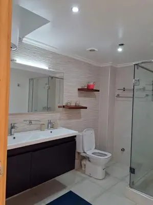 a bathroom with a toilet and a sink and a shower at Villa avec piscine, Hacienda Beach Sidi Rahal in Sidi Rahal