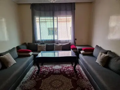 a living room with a couch and a window at Élégance et Confort à Ain Sebaa, Commodité,Plages in Casablanca