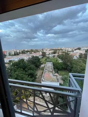 a view of a city from a balcony at Luxury studio center Abdelmoumen 1min tram with view in Casablanca