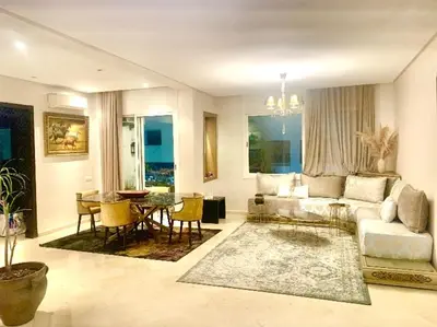 a living room with a couch and a table at Appartementperle in Casablanca