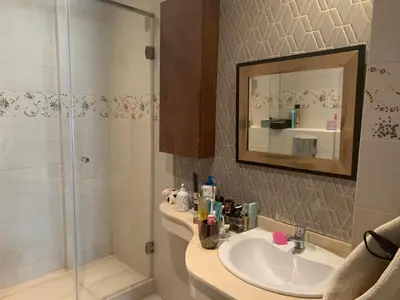 a bathroom with a sink and a shower at Appartementperle in Casablanca