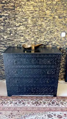 a black box with a clock on top of it at Elegant and Comfortable Apartment in the Heart of Rabat in Rabat
