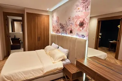 a bedroom with a bed and a painting on the wall at studio ghandi in Casablanca